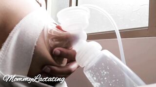 Fresh Milk inside the Morning with an Electric Pump Close up by