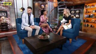 Ebony sports reporter shows a lot of leg