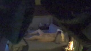 Woman alone in bed masturbating caught on hidden camera.