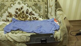 A pregnant mom masturbates into front of a web cam and