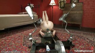 Red Haired milf takes machine inside booty