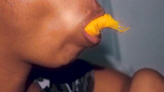 Hottie mouth black having fun with a mango
