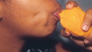 Hottie mouth black having fun with a mango