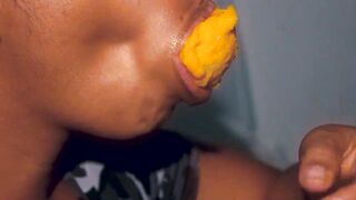 Hottie mouth black having fun with a mango
