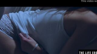 Rubbing her big puffy nipples as she fucks herself with