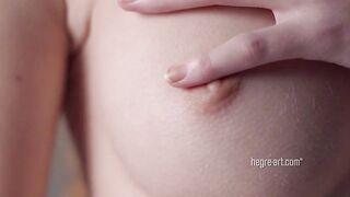 Sensual dance by a curly nude teenie