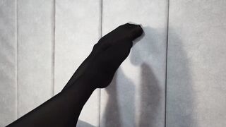 Stretching Beauty Legs and Foot inside African Tights Lying on the Bed