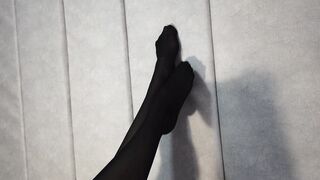 Stretching Beauty Legs and Foot inside African Tights Lying on the Bed