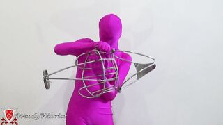 My Iron Maiden Corset is Locked over a Pink Zentai
