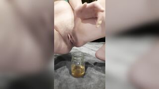 Cutie Nova Fills Glass Jar with Golden Pissing