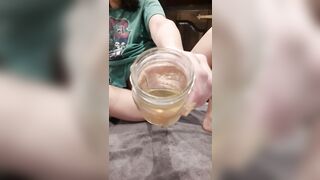 Cutie Nova Fills Glass Jar with Golden Pissing