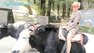 Angel Fowler having Fun Sitting on Yak