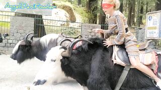 Angel Fowler having Fun Sitting on Yak