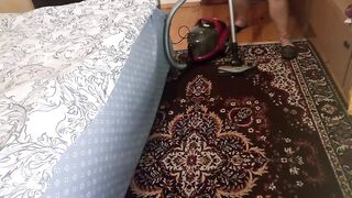 Beauty Chubby Ellie Cleans the Bedroom with a Vacuum Cleaner