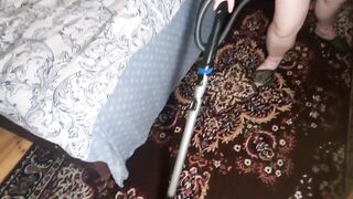 Beauty Chubby Ellie Cleans the Bedroom with a Vacuum Cleaner