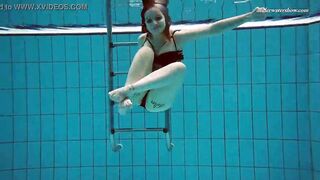 Huge boobs dark haired Bombshell Dashka swimming underwater