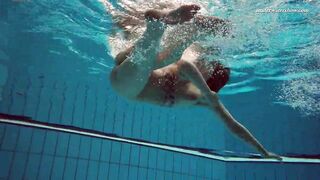 Huge boobs dark haired Bombshell Dashka swimming underwater