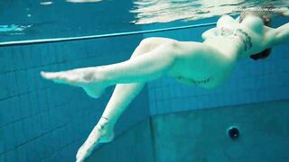 Huge boobs dark haired Bombshell Dashka swimming underwater