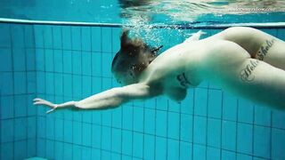 Huge boobs dark haired Bombshell Dashka swimming underwater