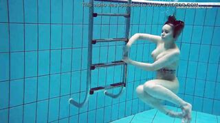 Huge boobs dark haired Bombshell Dashka swimming underwater