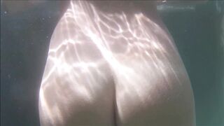 Swimming Nude into the Pool Underwater See