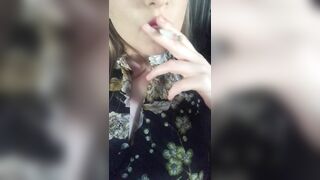 women inside a Dress Smokes Sexually