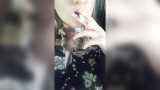 women inside a Dress Smokes Sexually