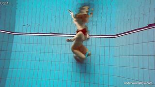 Huge melons slender goddess Deniska swimming inside the pool