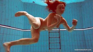 Huge melons slender goddess Deniska swimming inside the pool