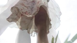 Camera look up Skirt into the Park. Close up under Skirt. Sweet
