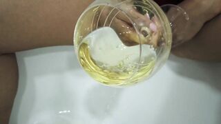 Pissing into a Glass with her Soak Snatch Close-up