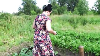 Big Boobed cougar masturbates with cucumber and strawberries public into a
