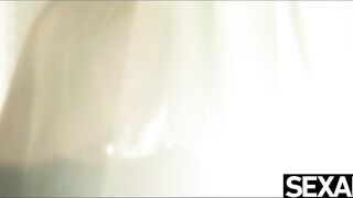 Beauty blonde plays with her long natural boobs as she