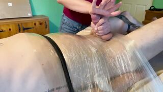 Extreme Post Orgasm Stroking while He’s Tied to the Table