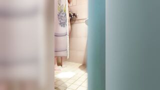 The Women is Washing into the Shower, she has Foam on her Booty