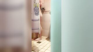The Women is Washing into the Shower, she has Foam on her Booty