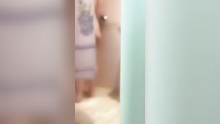 The Women is Washing into the Shower, she has Foam on her Booty