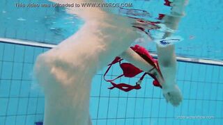 Red swimsuit babe Katy with hairy twat underwater