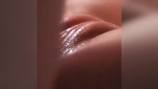 Close-up of gentle frictions. Play with cum on her twat