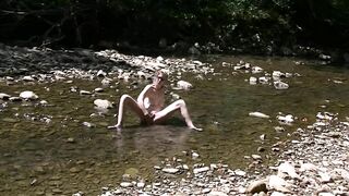 Masturbating with Wolf Sex Toy inside Creek