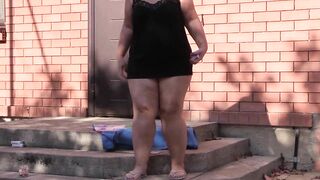 Older BBW smokes outside into outdoor places and shows her