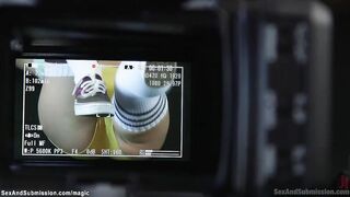 Camera man binds and whips instructor