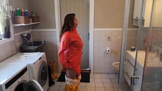 Getting Clothed inside Ella Rainpants and Hunter Boots