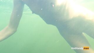 Nude cougar Swimming into the River with her Dogs (underwater