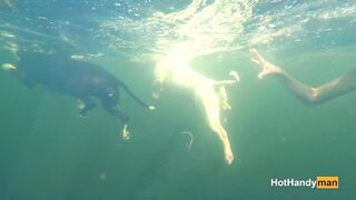 Nude cougar Swimming into the River with her Dogs (underwater
