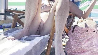 Fiance cool off out at the naked beach speads her legs.