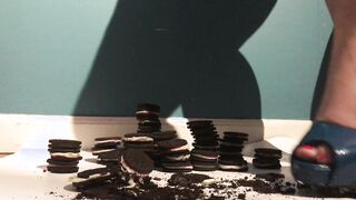 Beauty women inside Heels Crushes and Plays with Cookies