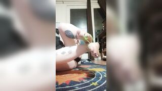 Gagged, she ties her foot with green string and stretches, wiggles and flexes until they break free