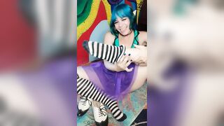 Elf chick takes off shoes and thigh highs