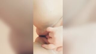 Curvy cunt with mouth fucks herself inside the butt with a plug and caresses her snatch